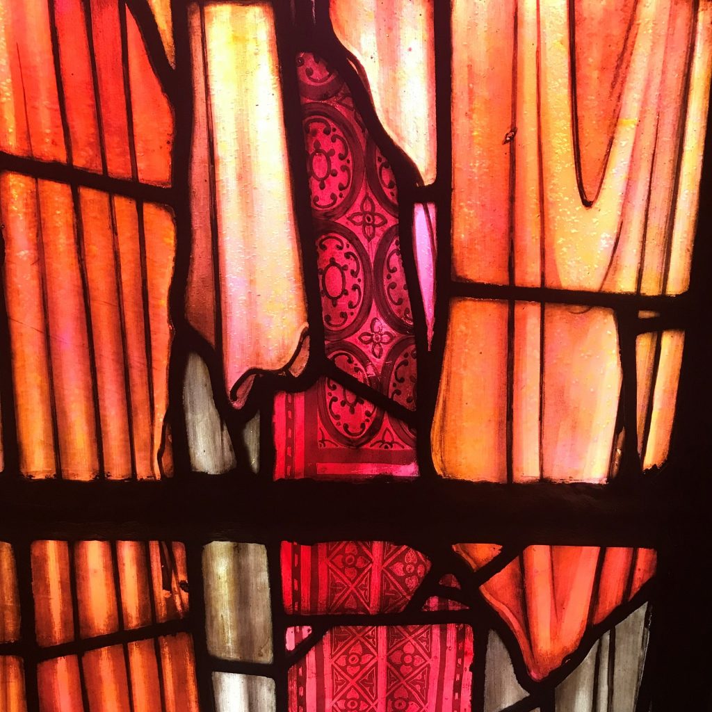 A section of clothing from The Ascension window, showing the intricate detail visible in the windows.