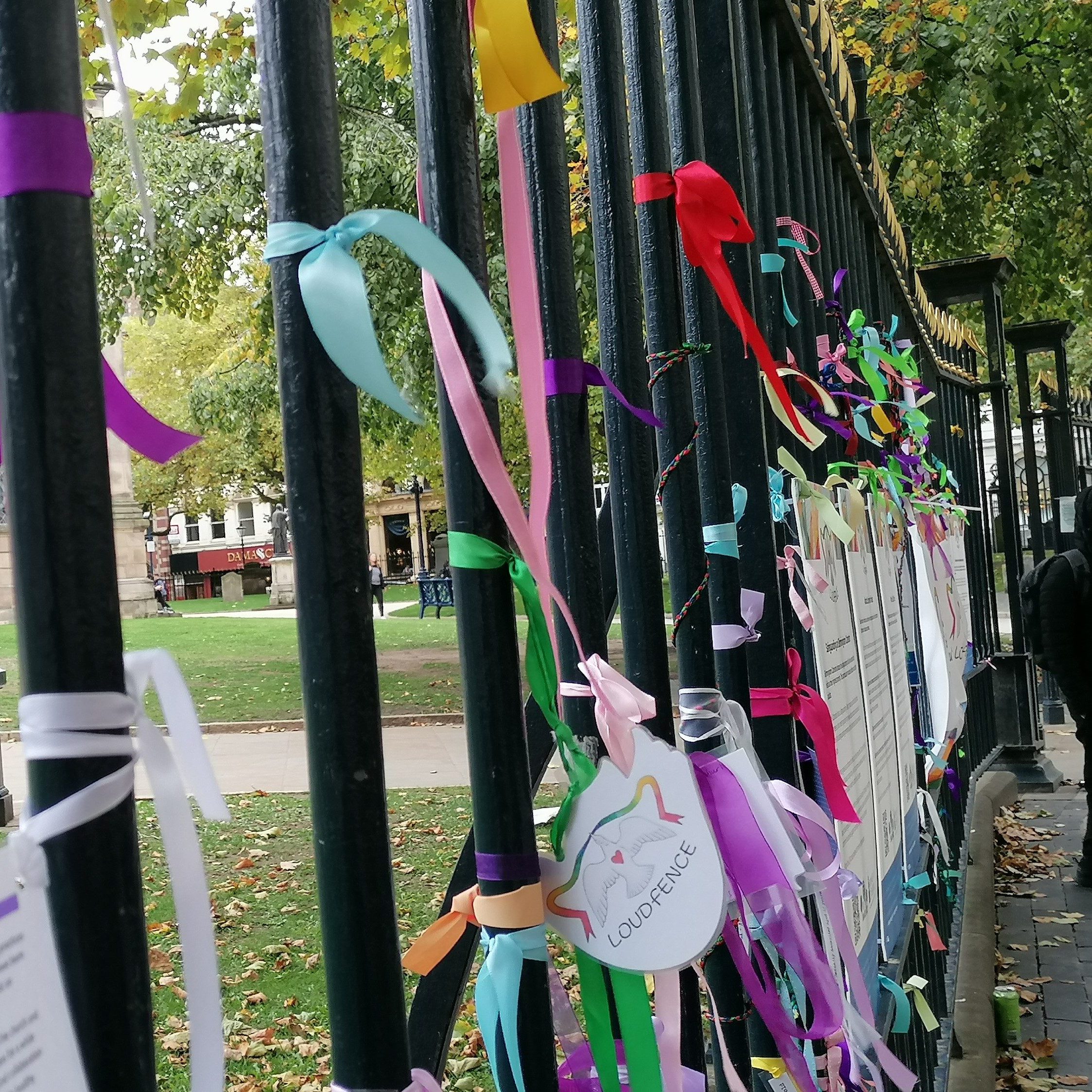 LOUDfence ribbons and messages displayed in the entrance to Birmingham Cathedral St Philip's and on the railings of Cathedral Square in October 2022.